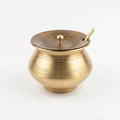 Kitchen Mart brass ghee pot 400 ml with hammered lid and brass spoon on white background