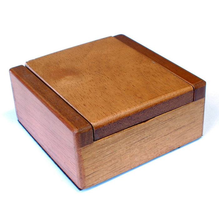 Old-Fashioned Metal Jacks in a Wooden Box