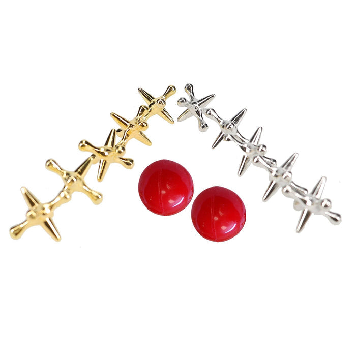 Old-Fashioned Metal Jacks in a Wooden Box