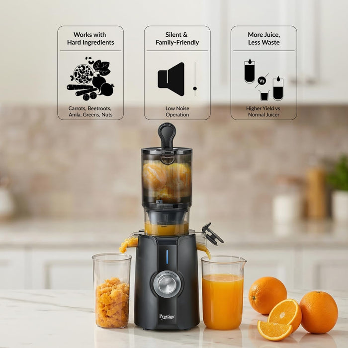 Black Prestige Natura slow juicer with juice and pulp collector cups on Indian kitchen counter